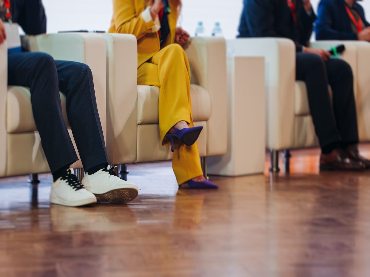 Speakers shoes and legs at a business conference event