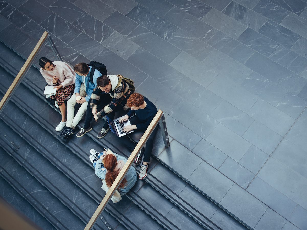 College students sitting on stairs 