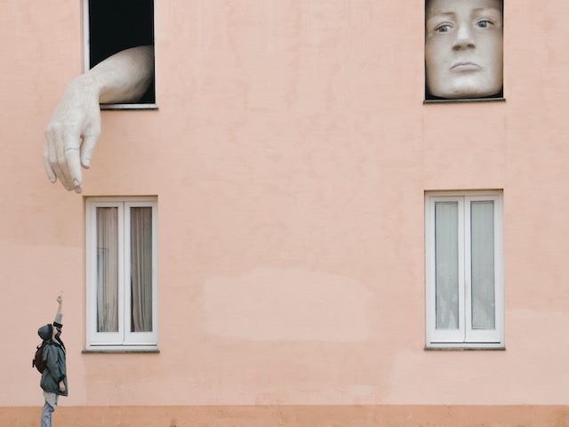 reaching for a giant in a window