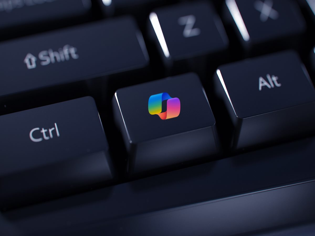 Colored Copilot AI logo on a black computer keyboard