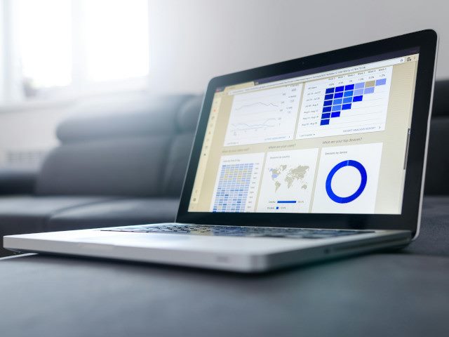 A laptop computer with a visual display of data analytics.
