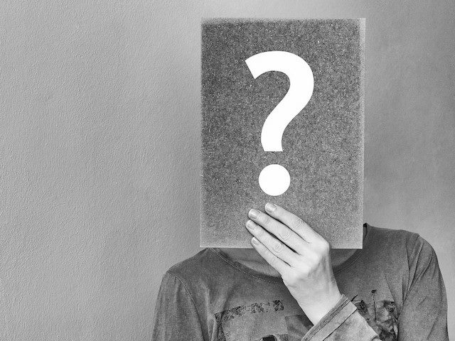 question mark in front of face
