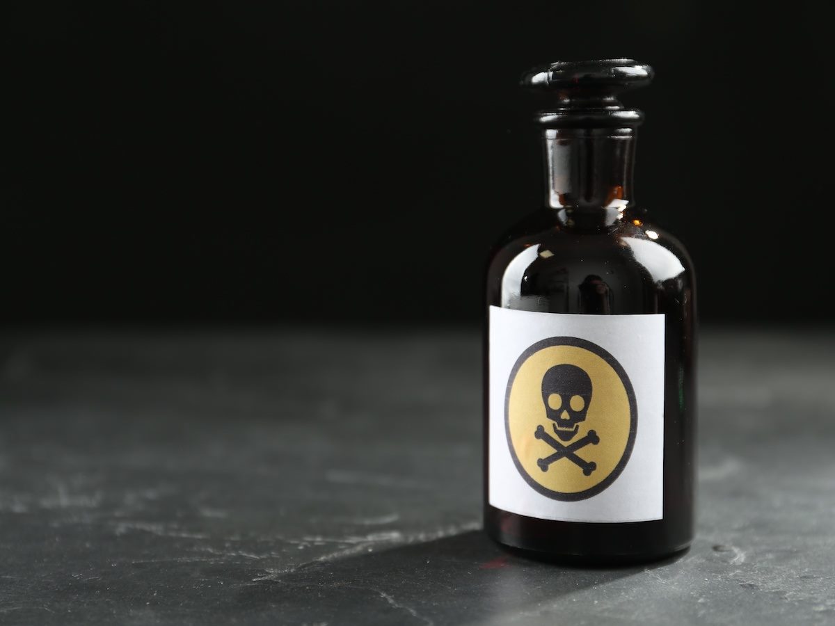 A bottle with a skull and crossbones "poison" label