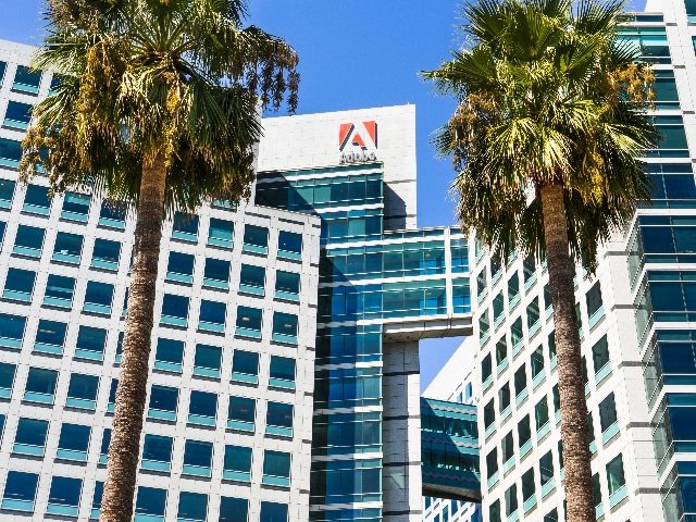 Adobe corporate headquarters in downtown San Jose shot from outside the building looking up. 