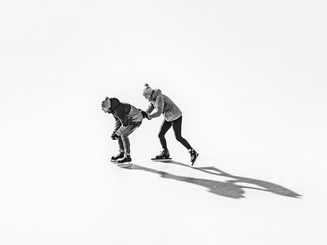 pushing someone else across the ice