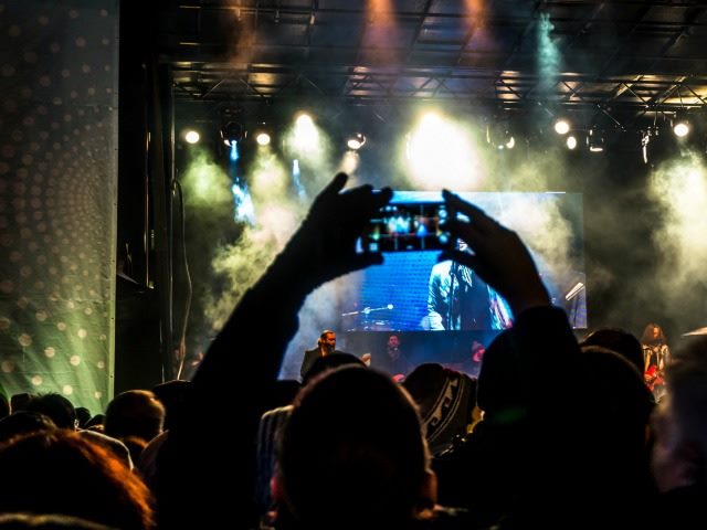 taking pictures at a concert