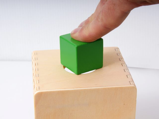 square peg being forced into a round hole