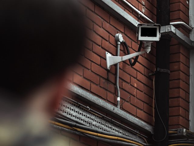 camera watching man,  implication of facial recognition