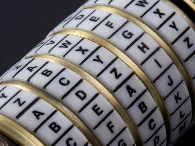 A secret password - combination puzzle box, rings of black letters on white tiles separated by gold metal representing decoding AI-driven personalization.