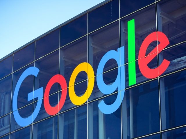 The Google name appears on a building in daytime.
