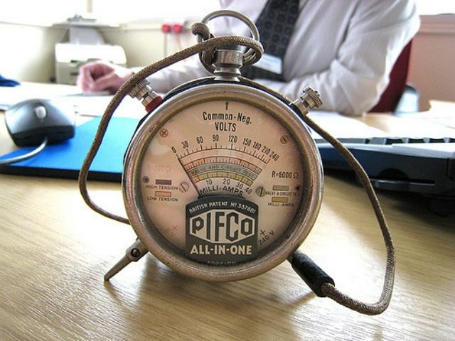volt meter on a person's desk
