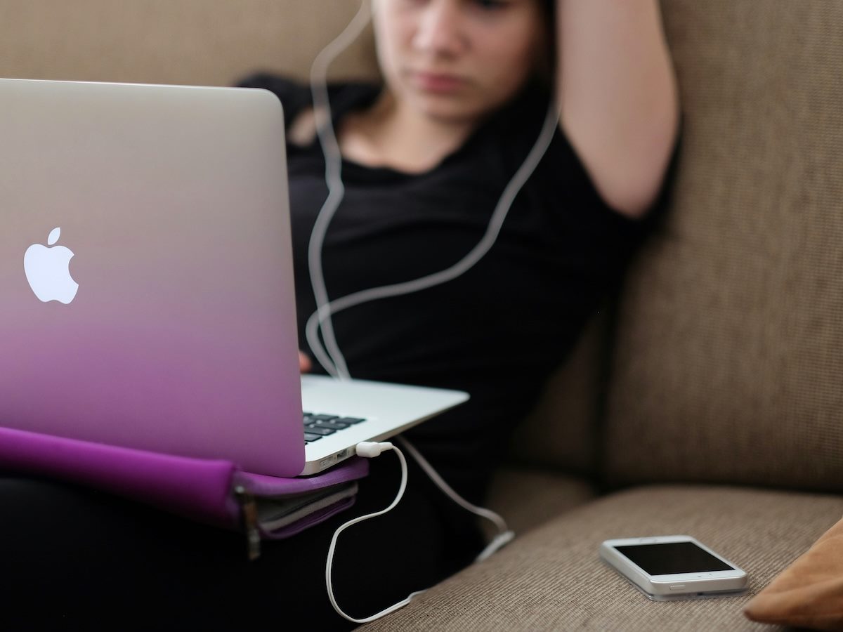 woman taking an online learning class, attentive and listening