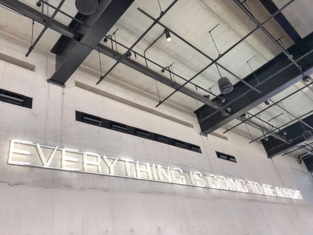 A neon sign that reads Everything is going to be alright on a white wall - sentiment analysis concept
