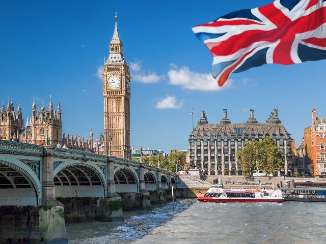 Big Ben and Houses of Parliament with boat in London, where the Competition and Markets Authority (CMA) is proposing AI principles around Foundational Models.
