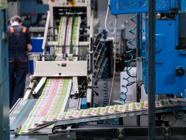  Conveyor belt with magazines in print shop.