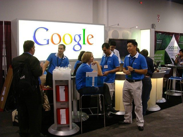 The Google booth with Google employees standing near it at a recent Pubcon conference.