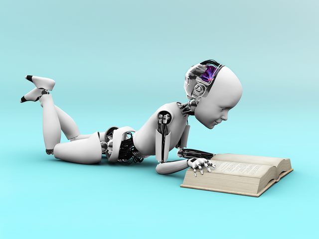 Robot child lying on the floor and reading a book. Bluish background