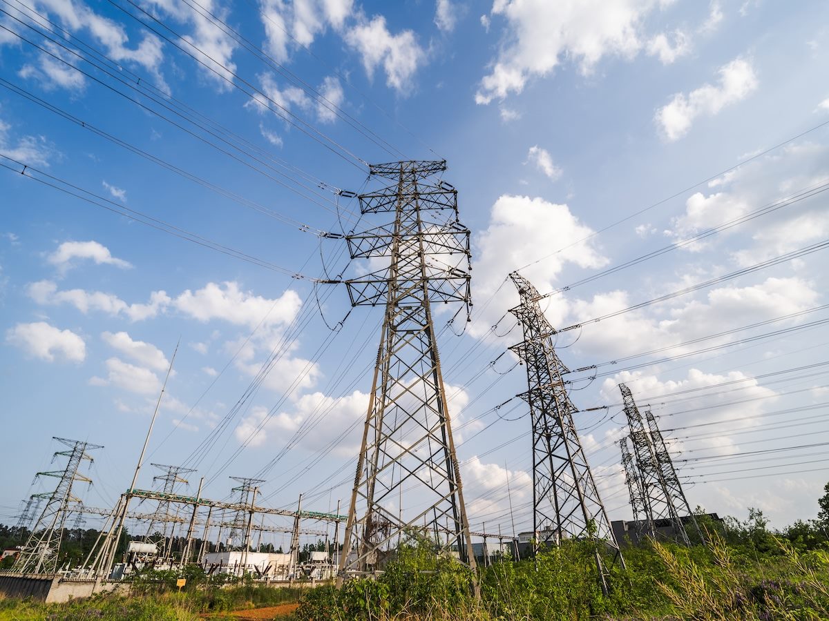 Multiple steel lattice transmission towers and power lines