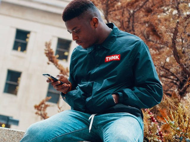 man looking at cellphone