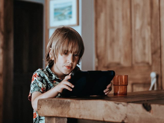 kid working on a tablet