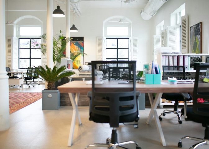 An office chair and desk and other office furniture in an office.