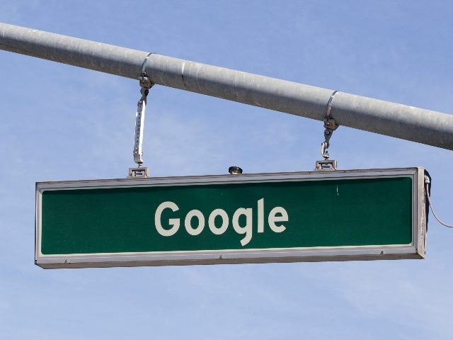 A green and white Google road sign seen at Googleplex, Google Headquarters in Mountain View, California. in piece about new Google Search features. 