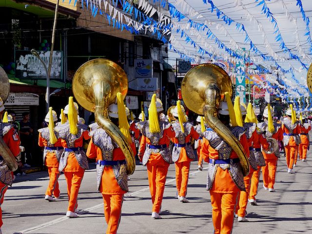 marching band walking in a parade