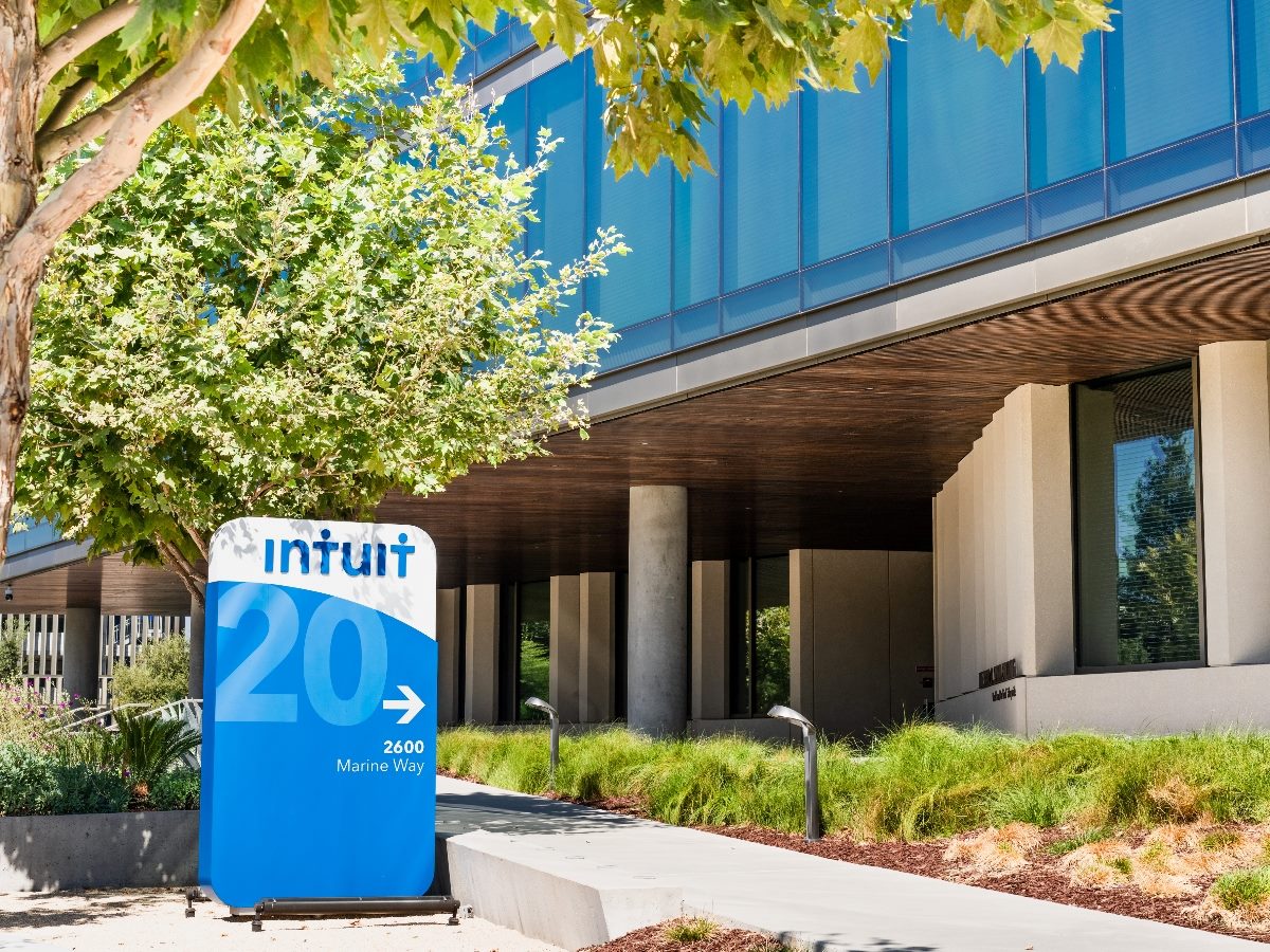 Intuit company building with a sign with Intuit colors and logo on it.