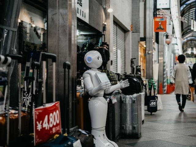 A robot standing outside of a marketplace