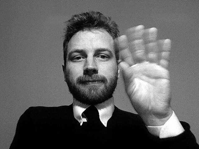 man waving goodbye