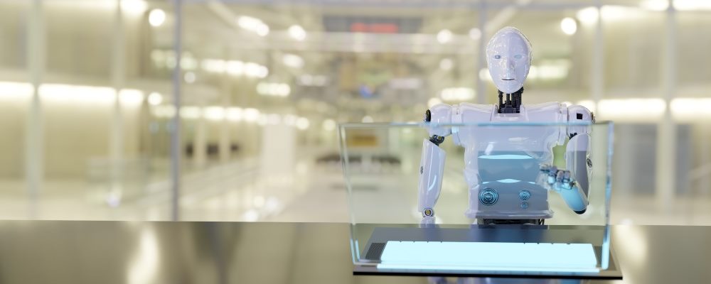 A white robot works in customers service using a chatbot and touchscreen.