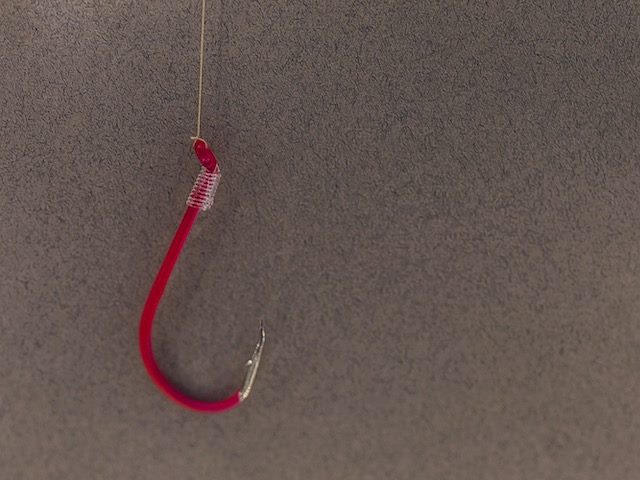 fishing hook made of computer wires, symbolizing a phishing attack