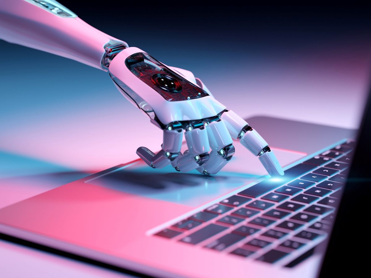 Robotic hand pressing a keyboard on a laptop; 3D rendering.