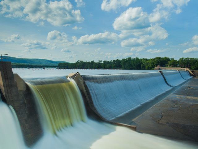 water flowing through a dam