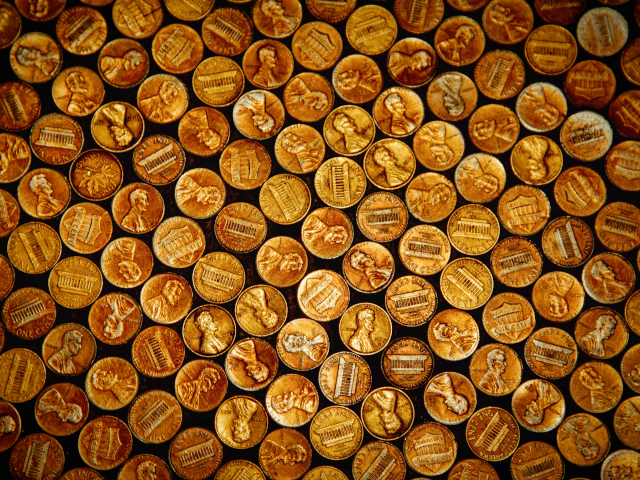 Rows of face-up and face-down pennies on a floor.