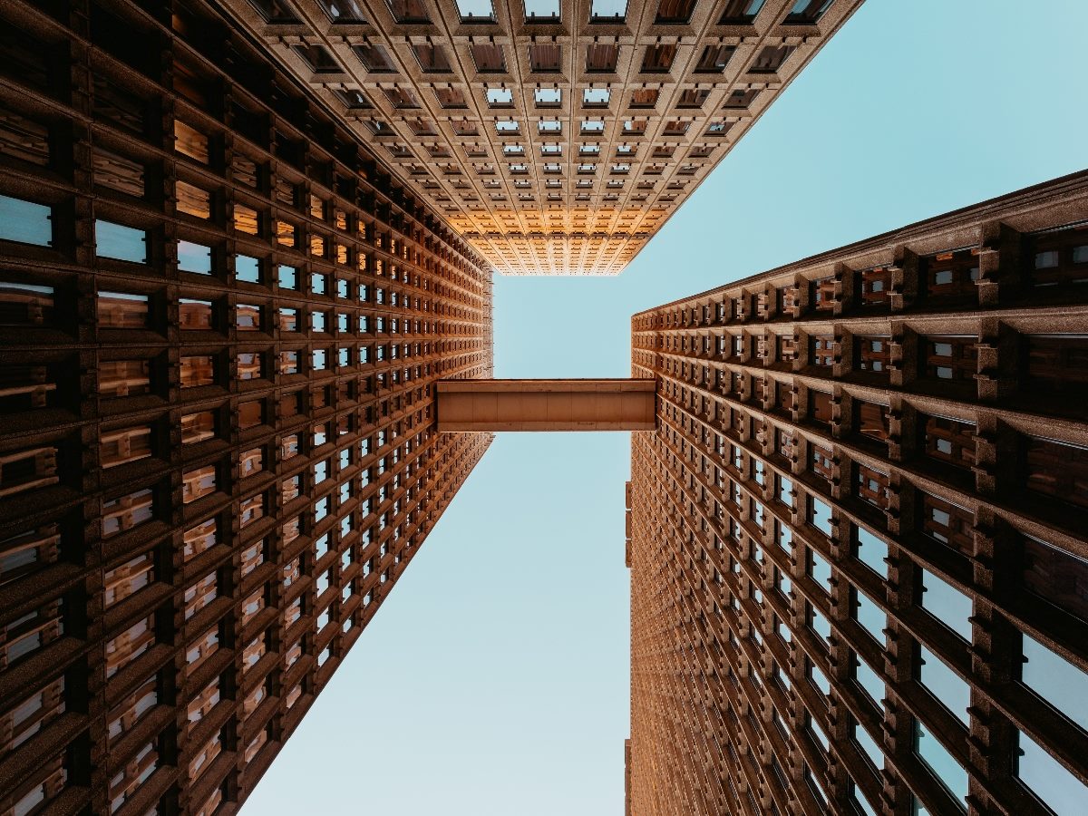 Tall building viewed from the ground up.