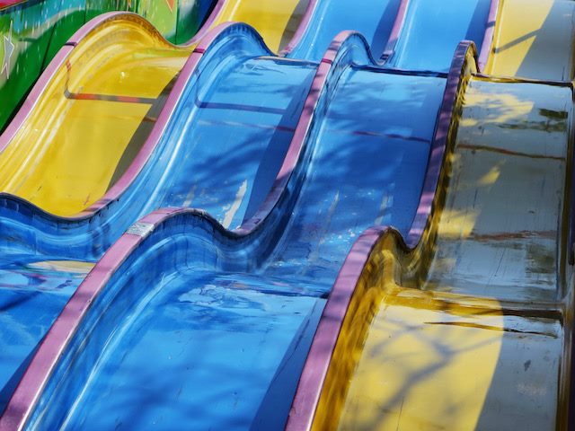a series of colorful slides designed to keep people in their own lane