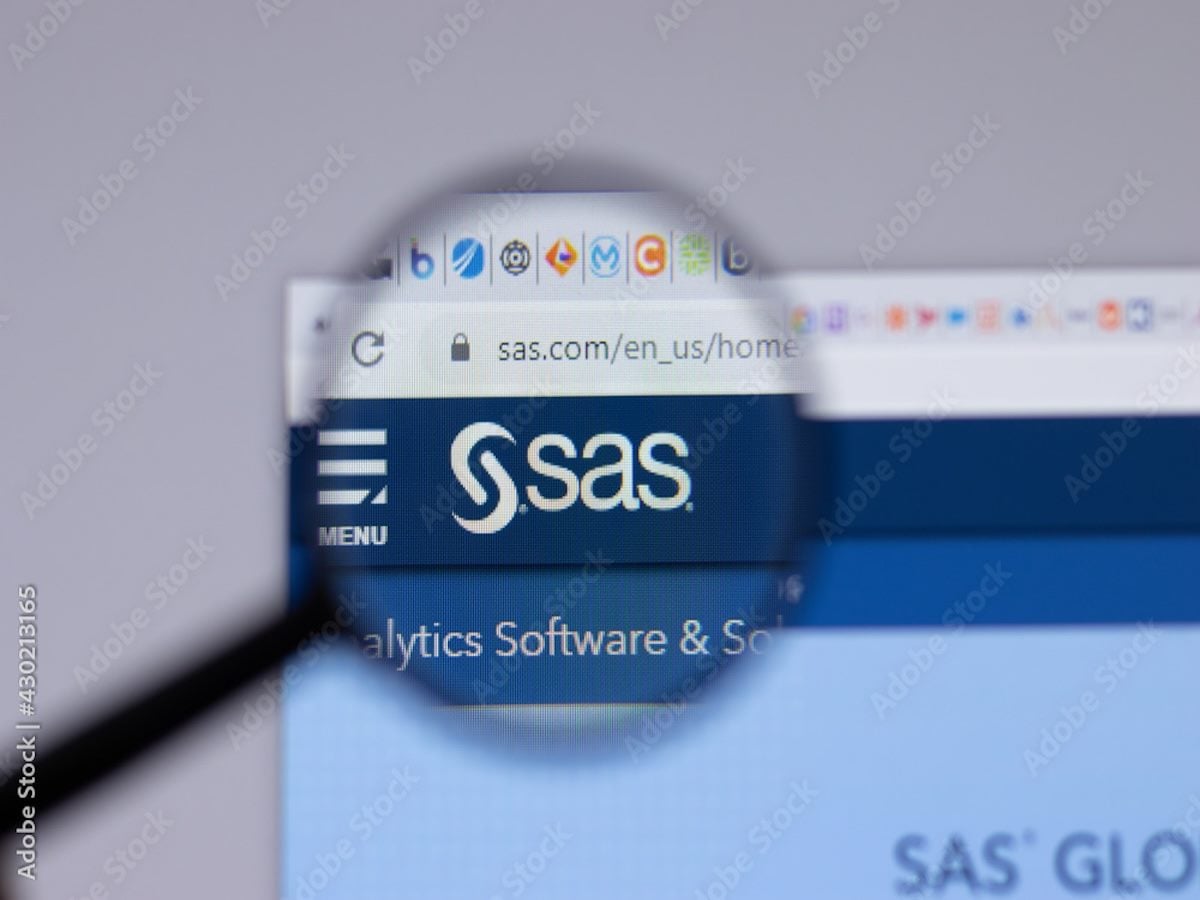 A magnifying glass hovering over the SAS logo on a computer