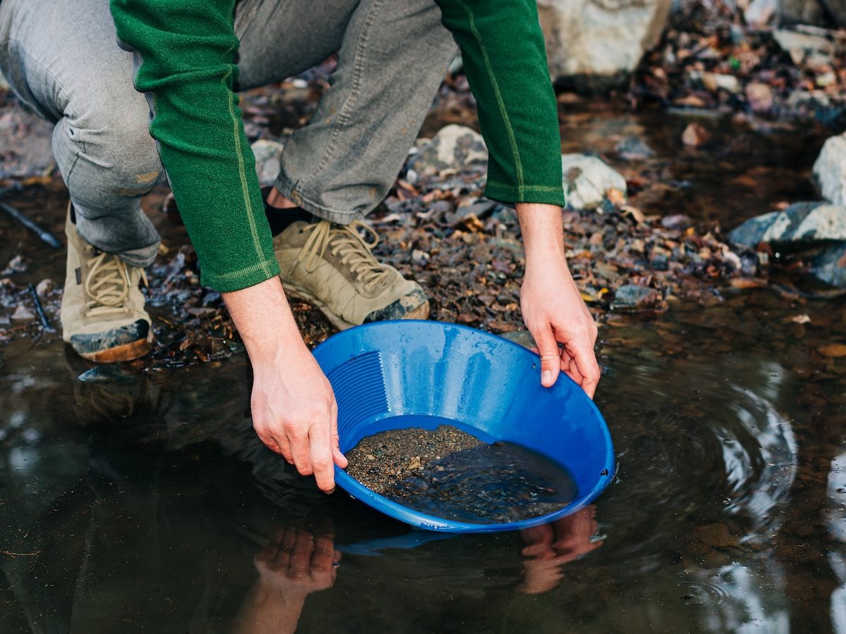 Gold Panning in Mountain Creek Using Blue Pan