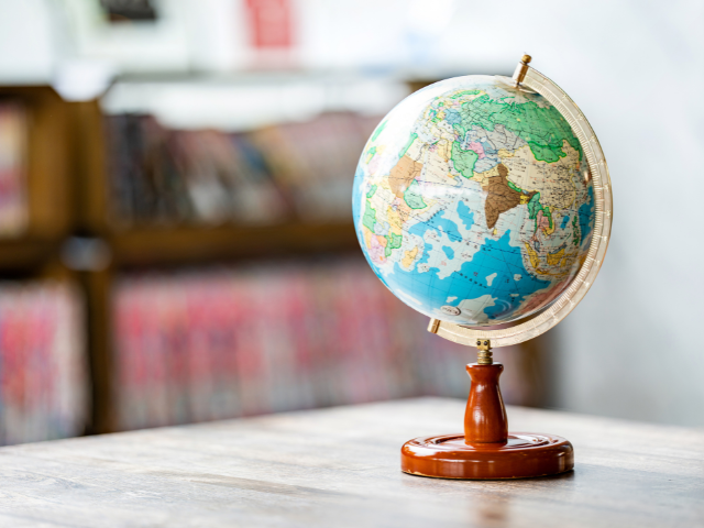 A world globe sitting on a table
