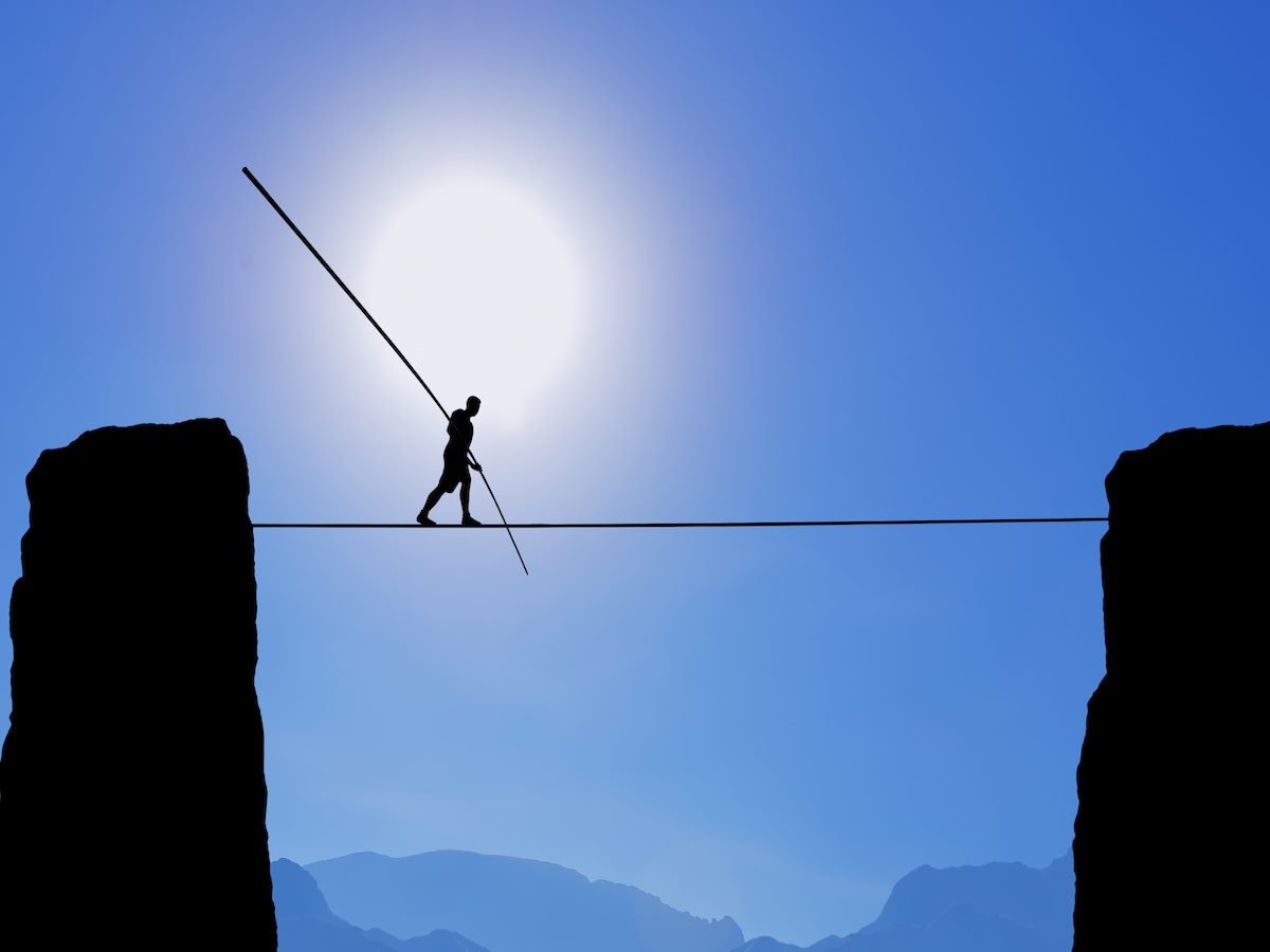 Tightrope Walker Balancing on the Rope