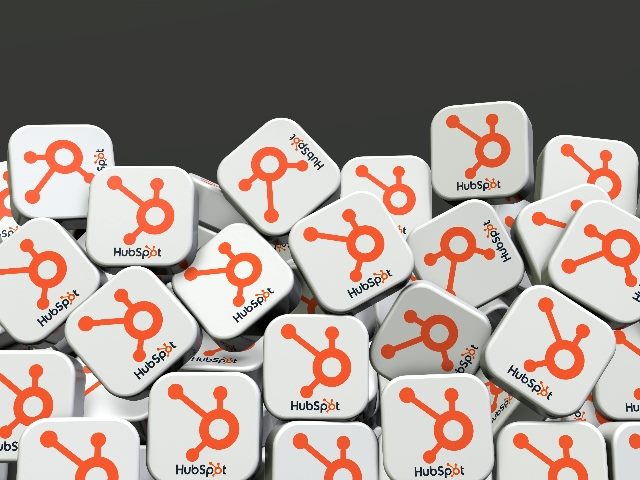 HubSpot's social media logos in the shape of dice. 