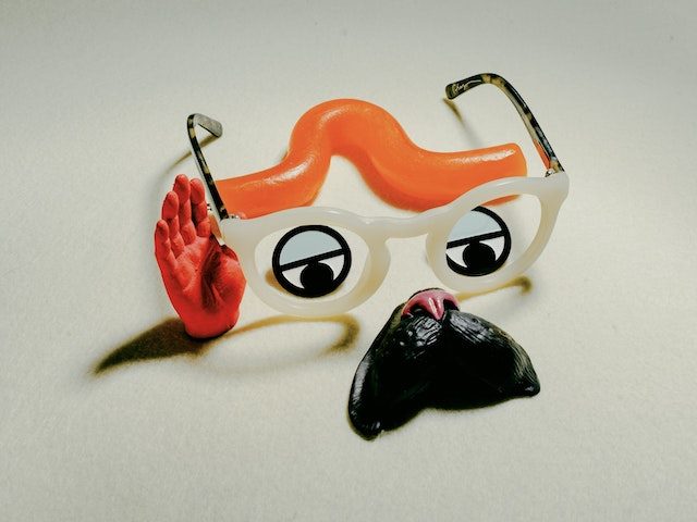 Plastic parts making up a face with mustache