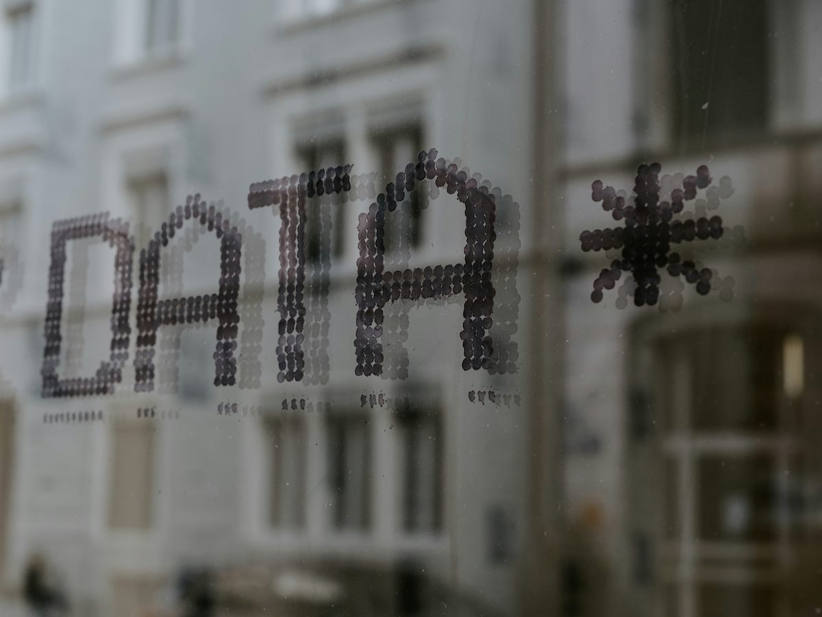 the word data written on glass in a pixelated font