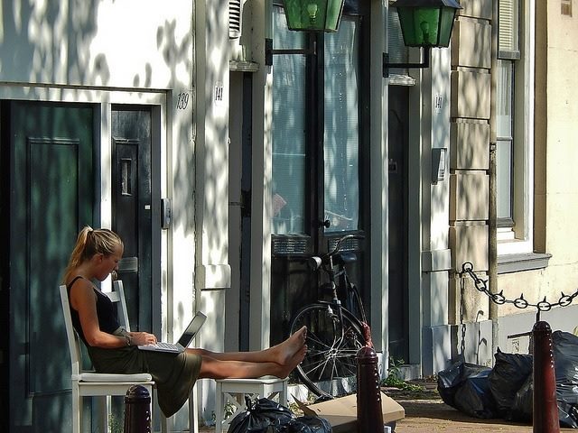 woman working on laptop in the sun