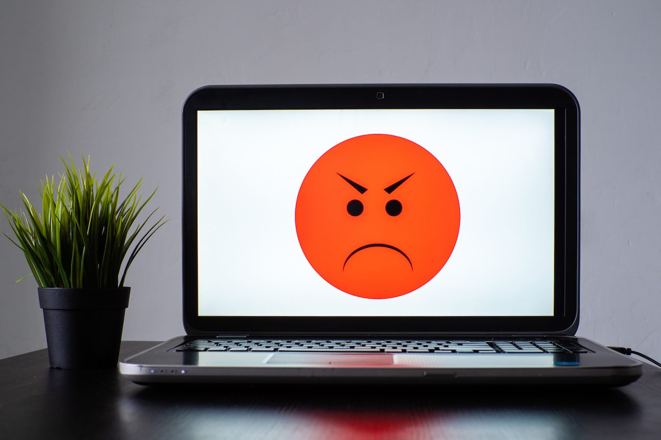 Evil face on computer screen