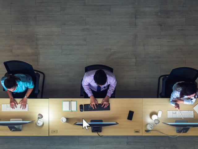 Three customer service workers answering calls in the contact center
