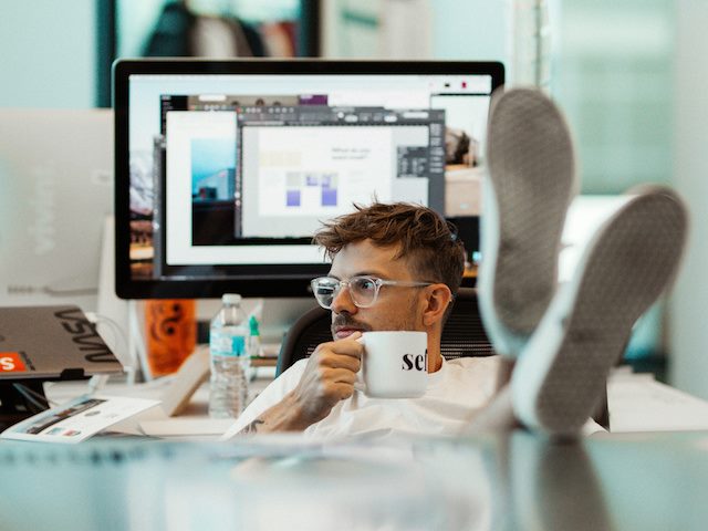 guy with his feet up relaxing because automation is doing so much of his work?