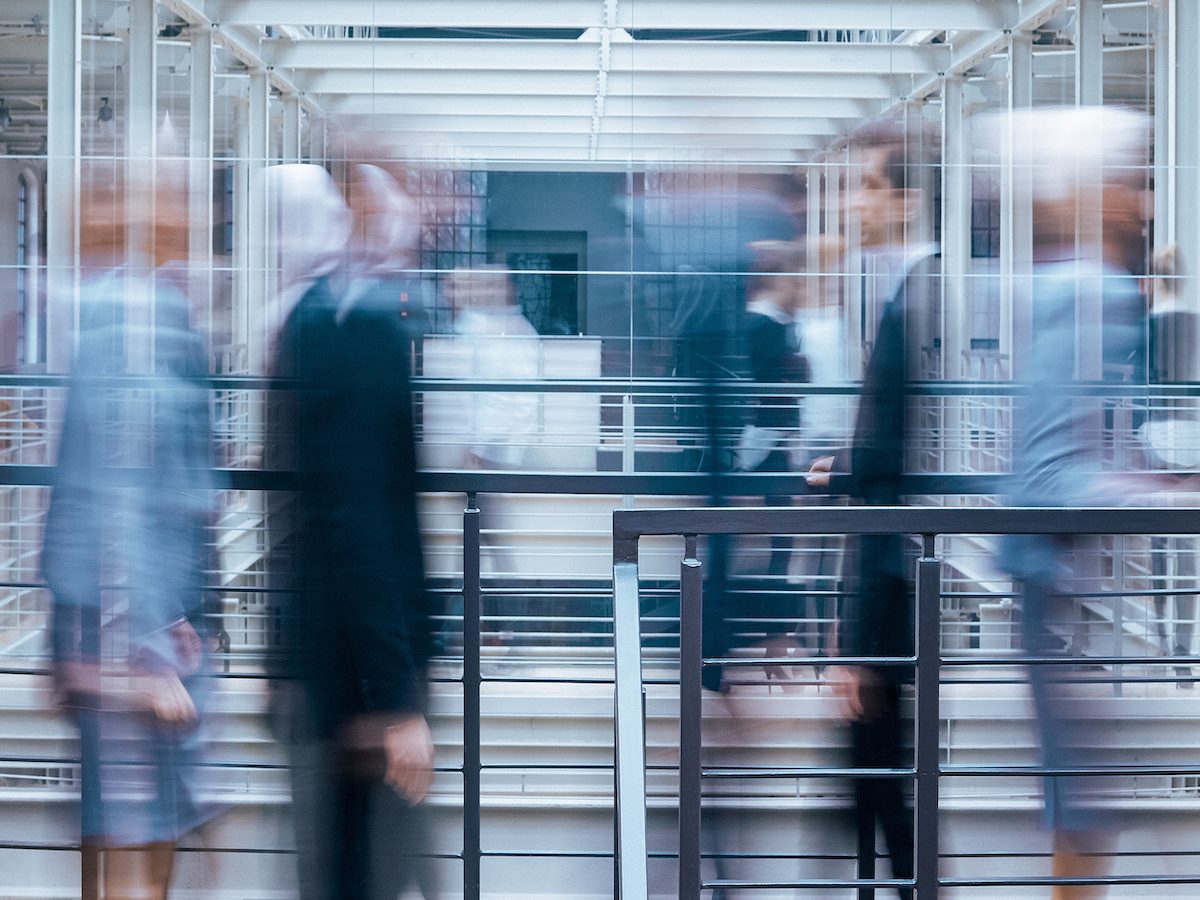 Business people talking in corridor 