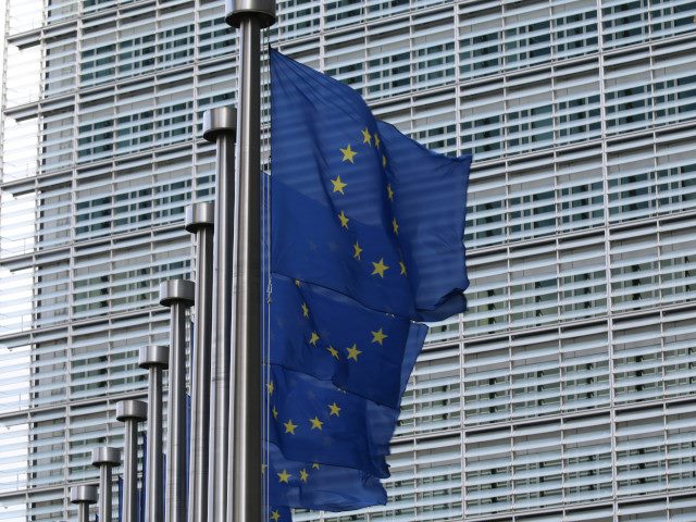 EU flags at the European Commission building in Belgium.